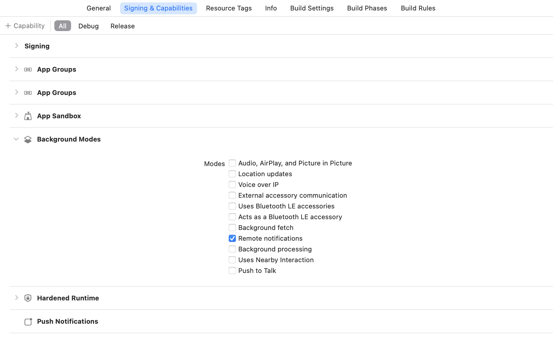 Xcode showing the "remote notifications" mode checkbox under "capabilities".